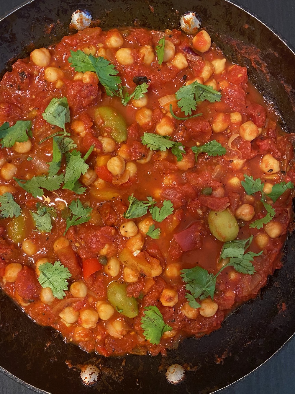 Chickpeas simmered in tomatoes.