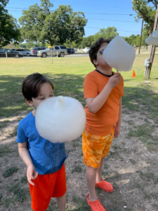 Ian's kids with giant cotton candy they found from a farmers market in the Hill Country area of Texas.